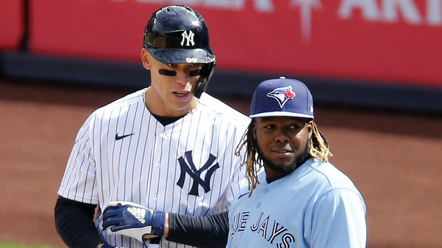 NEW YORK, NEW YORK - APRIL 01: (NEW YORK DAILIES OUT) Aaron Judge #99 of the New York Yankees in action against Vladimir Guerrero Jr. #27 of the Toronto Blue Jays at Yankee Stadium on April 01, 2021 in New York City. The Blue Jays defeated the Yankees 3-2 in ten innings.