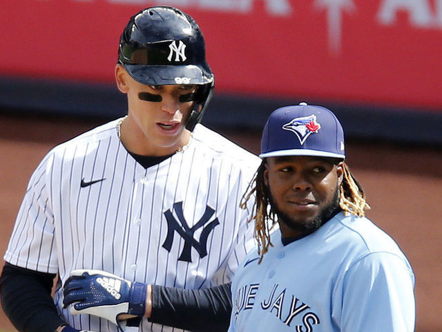NEW YORK, NEW YORK - APRIL 01: (NEW YORK DAILIES OUT) Aaron Judge #99 of the New York Yankees in action against Vladimir Guerrero Jr. #27 of the Toronto Blue Jays at Yankee Stadium on April 01, 2021 in New York City. The Blue Jays defeated the Yankees 3-2 in ten innings.