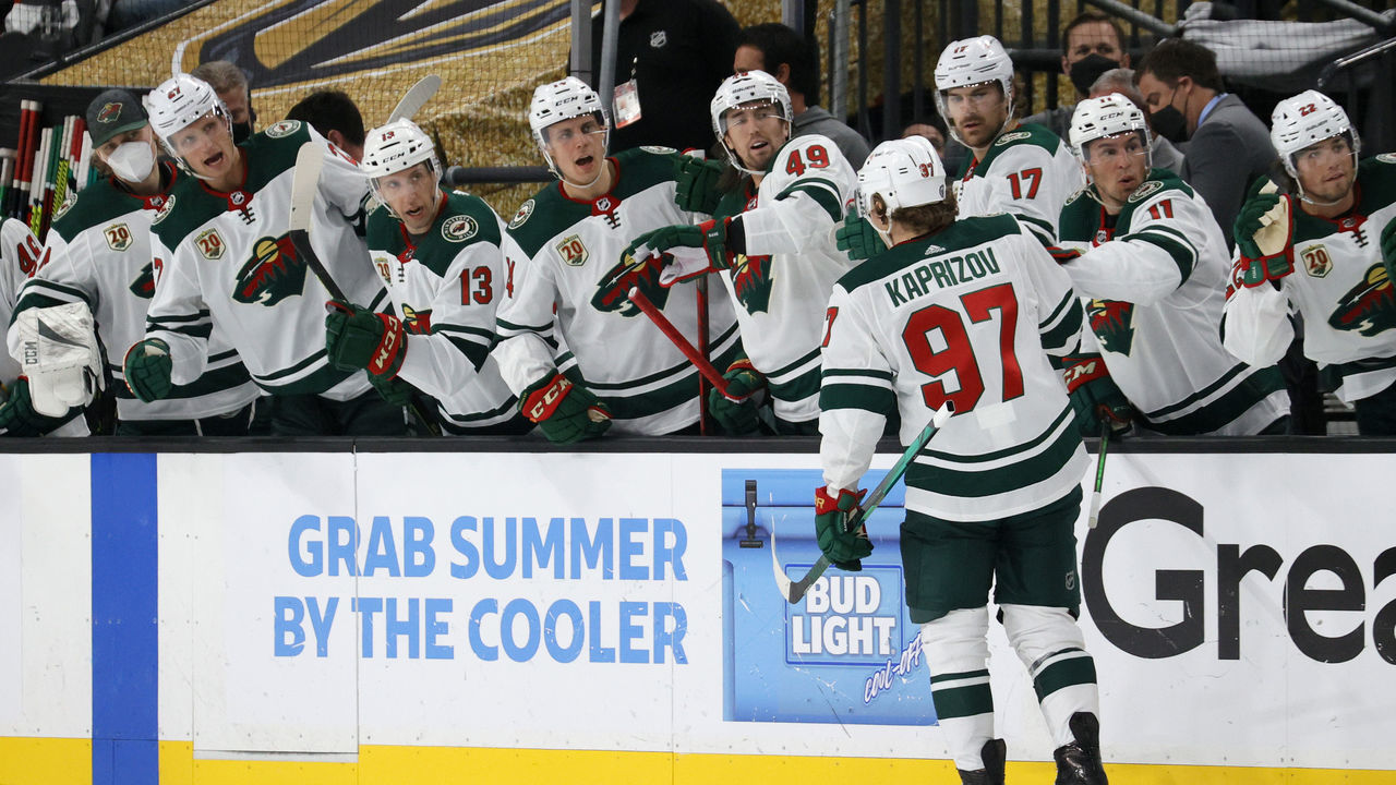 LAS VEGAS, NEVADA - MAY 24: Kirill Kaprizov #97 of the Minnesota Wild celebrates with teammates on the bench after scoring a first-period goal against the Vegas Golden Knights in Game Five of the First Round of the 2021 Stanley Cup Playoffs at T-Mobile Arena on May 24, 2021 in Las Vegas, Nevada. The Wild defeated the Golden Knights 4-2.