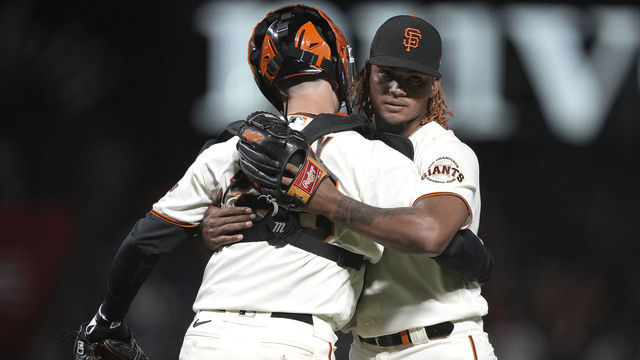 SAN FRANCISCO, CALIFORNIA - SEPTEMBER 29: Camilo Doval #75 and Buster Posey #28 of the San Francisco Giants celebrate after defeating the Arizona Diamondbacks 1-0 at Oracle Park on September 29, 2021 in San Francisco, California.