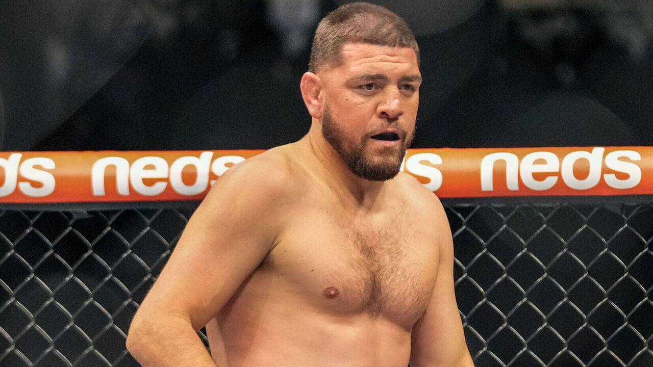 LAS VEGAS, NV - SEPTEMBER 25: (L-R) Nick Diaz battles Robbie Lawler in their middleweight fight during UFC 266 on September 25, 2021, at T-Mobile Arena in Las Vegas, NV.
