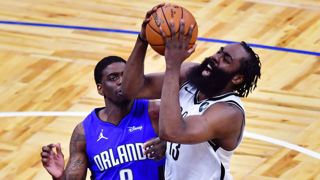 ORLANDO, FLORIDA - MARCH 19: James Harden #13 of the Brooklyn Nets draws the foul from Dwayne Bacon #8 of the Orlando Magic in the second half at Amway Center on March 19, 2021 in Orlando, Florida.
