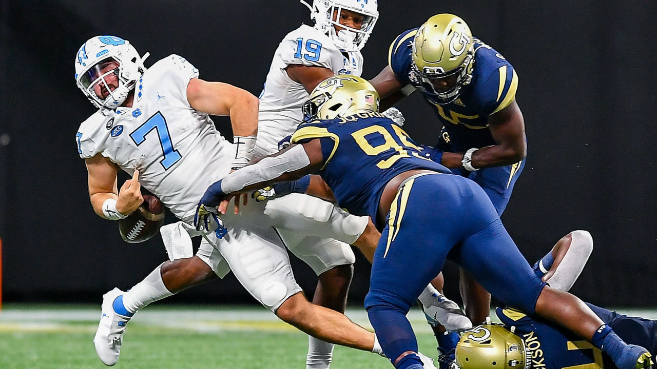 ATLANTA, GA SEPTEMBER 25: North Carolina quarterback Sam Howell (7) fumbles the ball after a hit from Georgia Tech defensive lineman Ja'Quon Griffin (95) during the NCAA football game between the North Carolina Tar Heels and Georgia Tech Yellow Jackets on September 25th, 2021 at Mercedes-Benz Stadium in Atlanta, GA.
