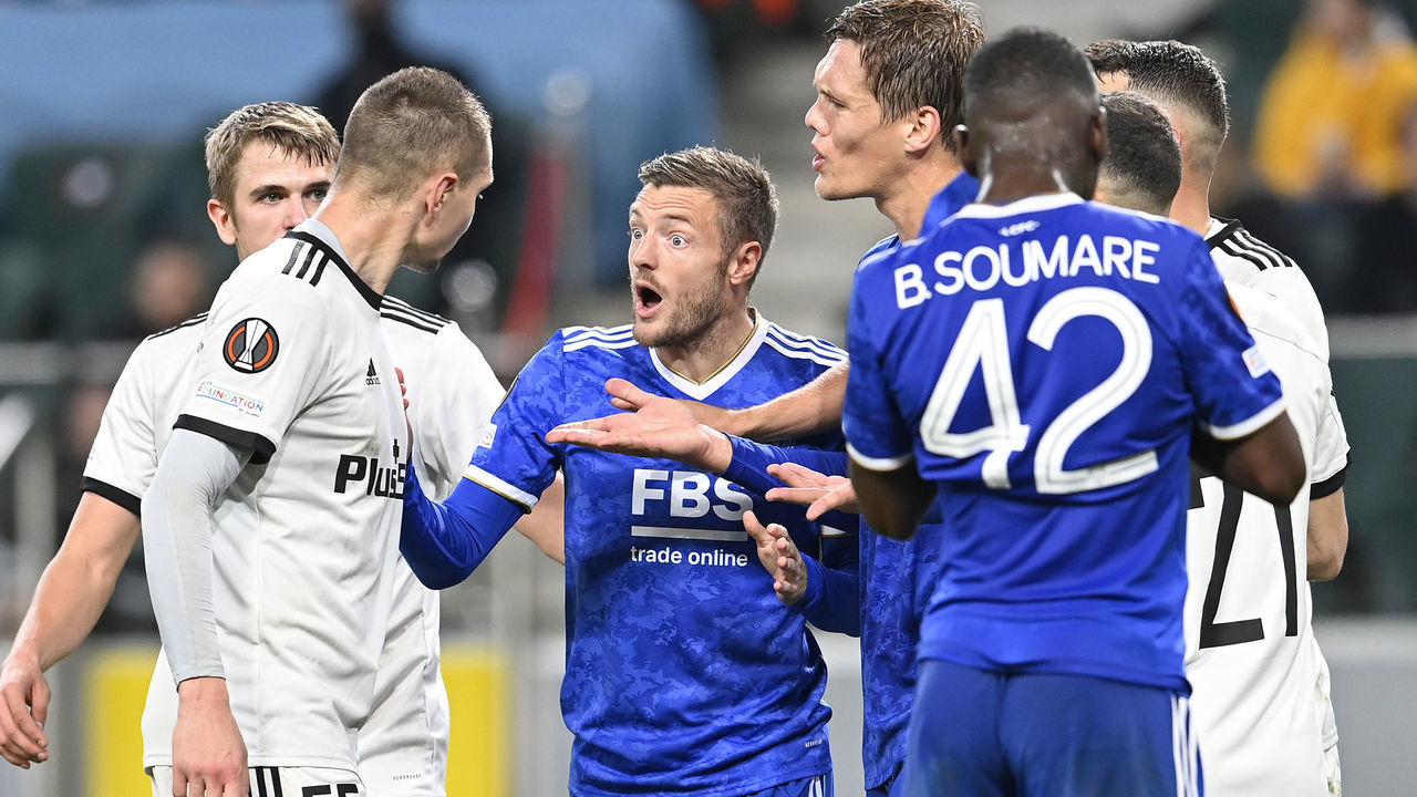 WARSAW, POLAND - SEPTEMBER 30: Jamie Vardy of Leicester City confronts with Artur Jedrzejczyk of Legia Warsaw during the UEFA Europa League group C match between Legia Warszawa and Leicester City at Wojska Polskiego Stadium on September 30, 2021 in Warsaw, Poland.