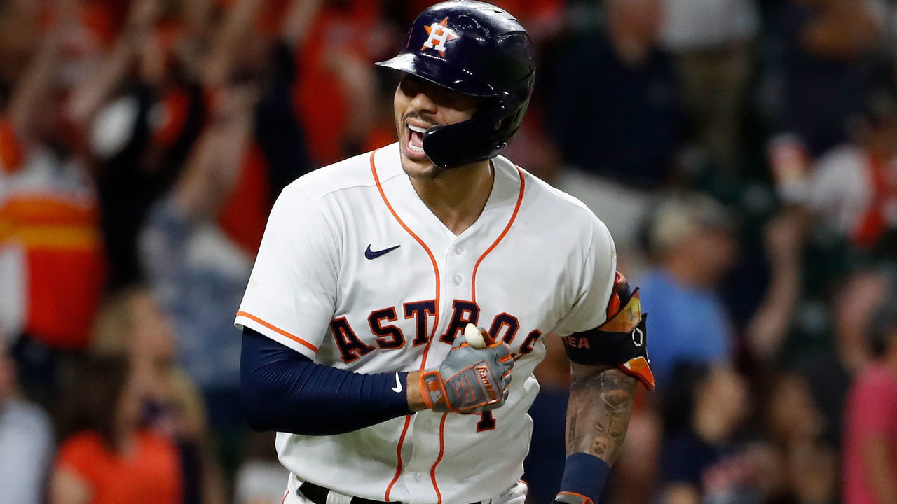 HOUSTON, TEXAS - SEPTEMBER 30: Carlos Correa #1 of the Houston Astros hits a three run home run in the fourth inning against the Tampa Bay Rays at Minute Maid Park on September 30, 2021 in Houston, Texas.
