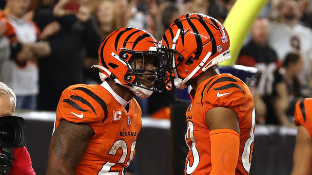 CINCINNATI, OHIO - SEPTEMBER 30: Joe Mixon #28 of the Cincinnati Bengals celebrates scoring a touchdown against the Jacksonville Jaguars with teammate Tyler Boyd #83 during the second half of an NFL football game at Paul Brown Stadium on September 30, 2021 in Cincinnati, Ohio.