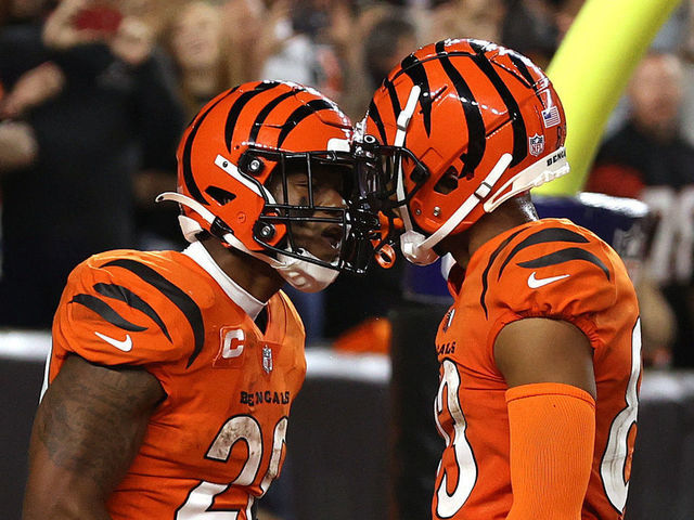 CINCINNATI, OHIO - SEPTEMBER 30: Joe Mixon #28 of the Cincinnati Bengals celebrates scoring a touchdown against the Jacksonville Jaguars with teammate Tyler Boyd #83 during the second half of an NFL football game at Paul Brown Stadium on September 30, 2021 in Cincinnati, Ohio.