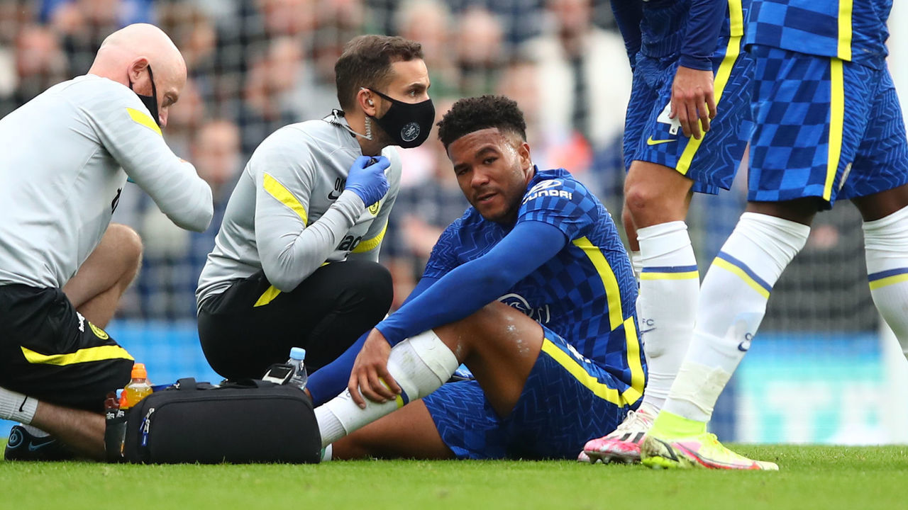 LONDON, ENGLAND - SEPTEMBER 25: Reece James of Chelsea is treated before leaving the game injured during the Premier League match between Chelsea and Manchester City at Stamford Bridge on September 25, 2021 in London, England.