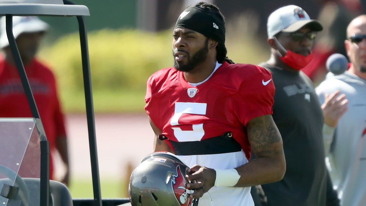 TAMPA, FL - SEP 29: Newly signed Tampa Bay Buccaneers defensive back Richard Sherman (5) walks over to his fellow defensive backs during the Tampa Bay Buccaneers work out on September 29, 2021 at the AdventHealth Training Center at One Buccaneer Place in Tampa, Florida.