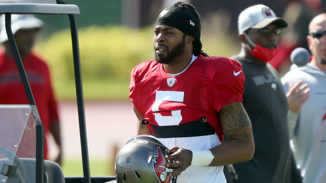 TAMPA, FL - SEP 29: Newly signed Tampa Bay Buccaneers defensive back Richard Sherman (5) walks over to his fellow defensive backs during the Tampa Bay Buccaneers work out on September 29, 2021 at the AdventHealth Training Center at One Buccaneer Place in Tampa, Florida.