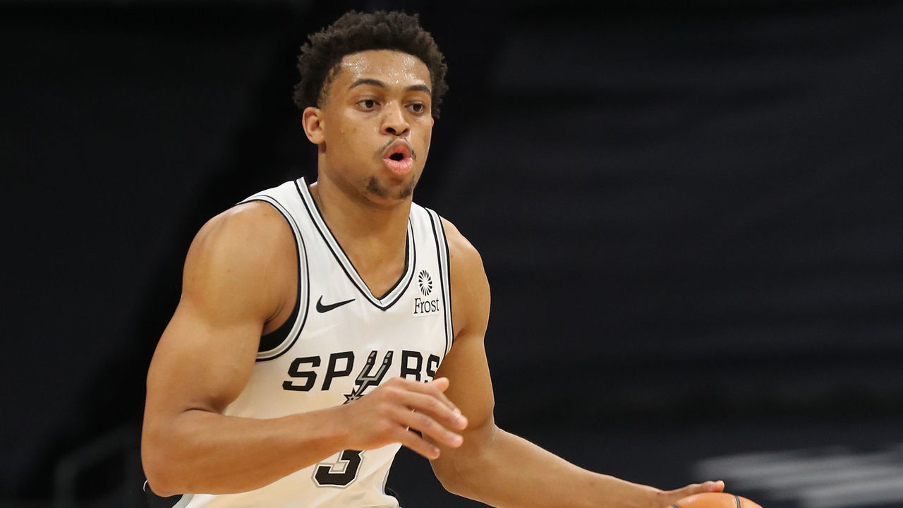CHARLOTTE, NC - FEBRUARY 14: Keldon Johnson #3 of the San Antonio Spurs dribbles the ball against the Charlotte Hornets on February 14, 2021 at Spectrum Center in Charlotte, North Carolina. Mandatory Copyright Notice: Copyright 2021 NBAE