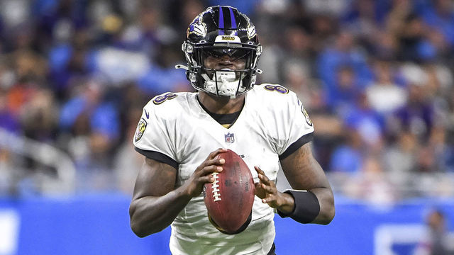 DETROIT, MICHIGAN - SEPTEMBER 26: Lamar Jackson #8 of the Baltimore Ravens looks to pass against the Detroit Lions during the third quarter at Ford Field on September 26, 2021 in Detroit, Michigan.