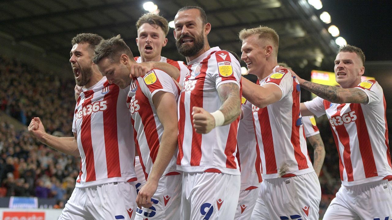 STOKE ON TRENT, ENGLAND - OCTOBER 01: Goalscorer Nick Powell of Stoke City, second from left, celebrates with teammates Tommy Smith, Harry Souttar, Steven Fletcher, Sam Surridge and Josh Tymon during the Sky Bet Championship match between Stoke City and West Bromwich Albion at Bet365 Stadium on October 01, 2021 in Stoke on Trent, England.