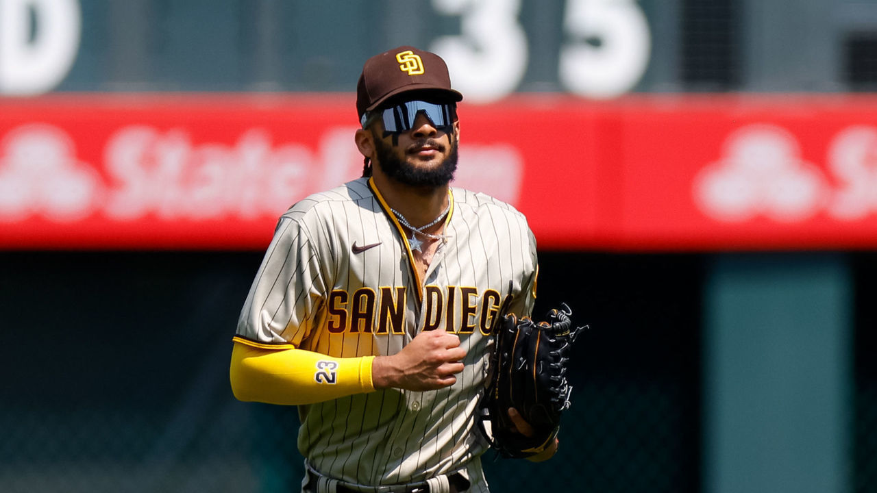 DENVER, CO - AUGUST 18: Right fielder Fernando Tatis Jr. #23 of the San Diego Padres jogs to the dugout from the outfield during the first inning against the Colorado Rockies at Coors Field on August 18, 2021 in Denver, Colorado.