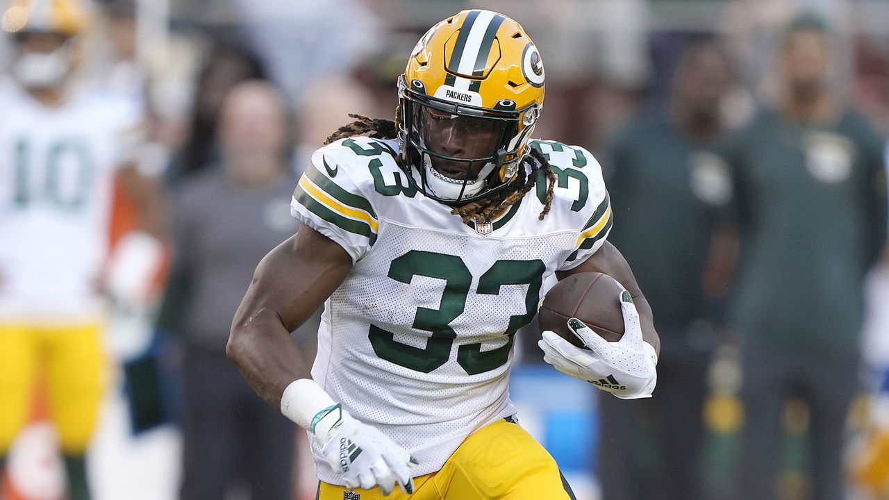 SANTA CLARA, CALIFORNIA - SEPTEMBER 26: Aaron Jones #33 of the Green Bay Packers carries the ball against the San Francisco 49ers in the first quarter at Levi's Stadium on September 26, 2021 in Santa Clara, California.