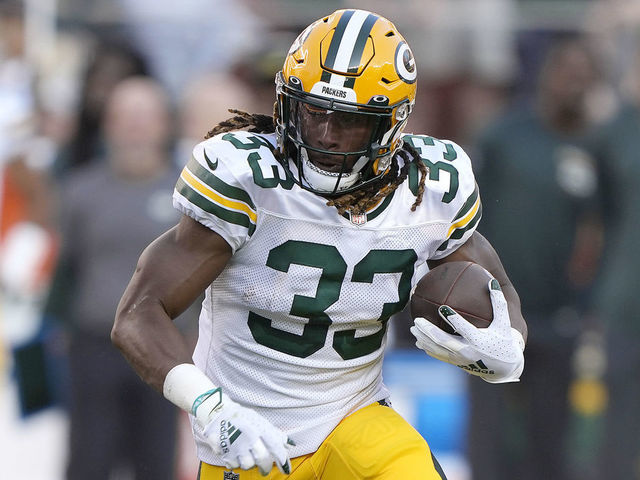 SANTA CLARA, CALIFORNIA - SEPTEMBER 26: Aaron Jones #33 of the Green Bay Packers carries the ball against the San Francisco 49ers in the first quarter at Levi's Stadium on September 26, 2021 in Santa Clara, California.