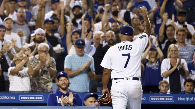 LOS ANGELES, CALIFORNIA - OCTOBER 02: Julio Urias #7 of the Los Angeles Dodgers reacts to the crowd as he exits the game in the seventh inning against the Milwaukee Brewers at Dodger Stadium on October 02, 2021 in Los Angeles, California.