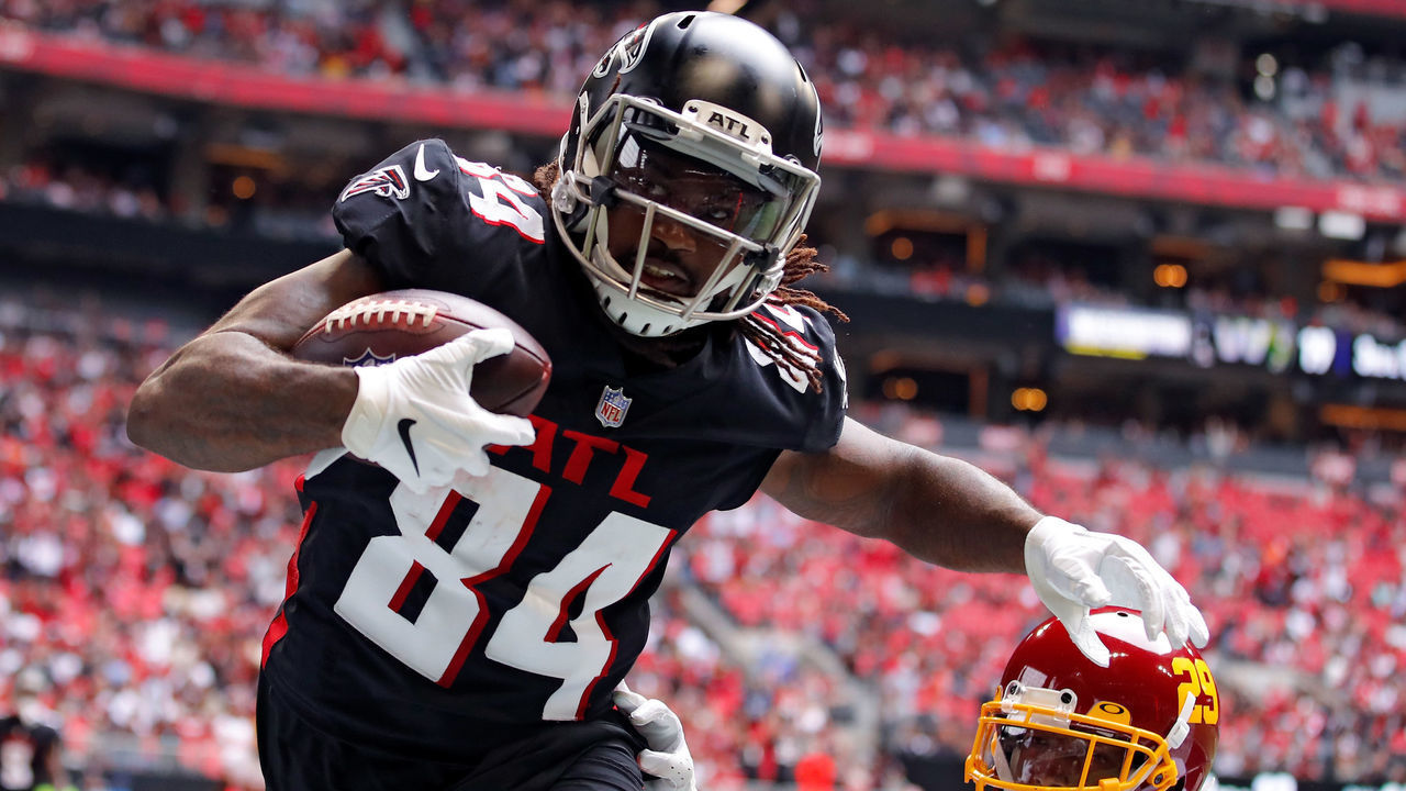 ATLANTA, GEORGIA - OCTOBER 03: Cordarrelle Patterson #84 of the Atlanta Falcons scores a touchdown reception against Kendall Fuller #29 of the Washington Football Team in the third quarter at Mercedes-Benz Stadium on October 03, 2021 in Atlanta, Georgia.