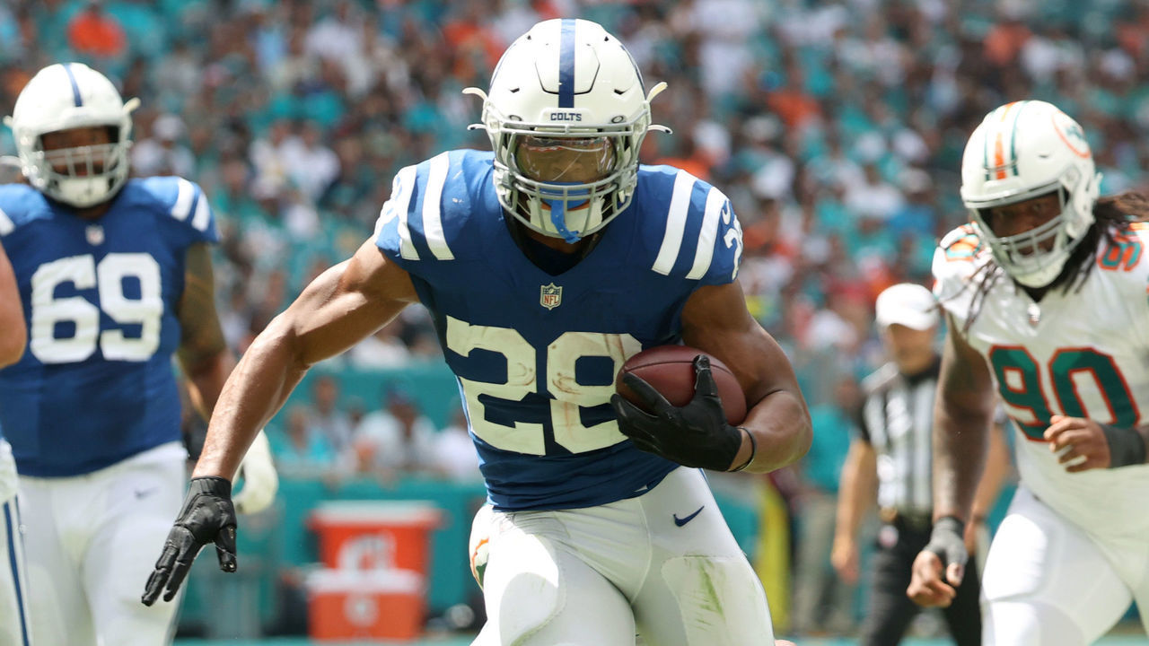 MIAMI GARDENS, FLORIDA - OCTOBER 03: Jonathan Taylor #28 of the Indianapolis Colts runs the ball during the second quarter in the game against the Miami Dolphins at Hard Rock Stadium on October 03, 2021 in Miami Gardens, Florida.