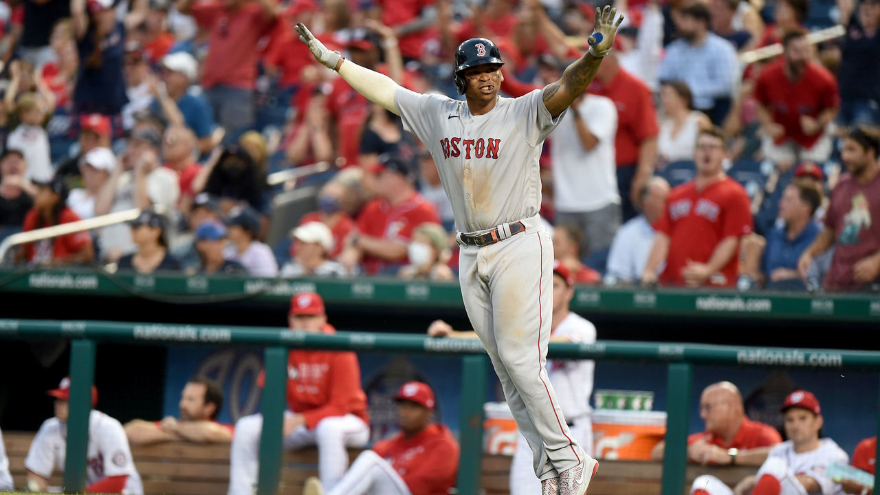 WASHINGTON, DC - OCTOBER 03: Rafael Devers #11 of the Boston Red Sox celebrates after hitting the game winning two-run home run in the ninth inning against the Washington Nationals at Nationals Park on October 03, 2021 in Washington, DC.