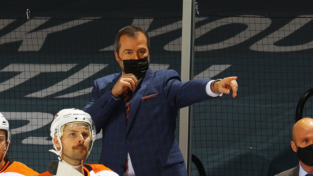 UNIONDALE, NEW YORK - MARCH 18: Alain Vigneault of the Philadelphia Flyers looks on from the bench during the game against the New York Islanders at Nassau Coliseum on March 18, 2021 in Uniondale, New York. Philadelphia Flyers defeated the New York Islanders 4-3.