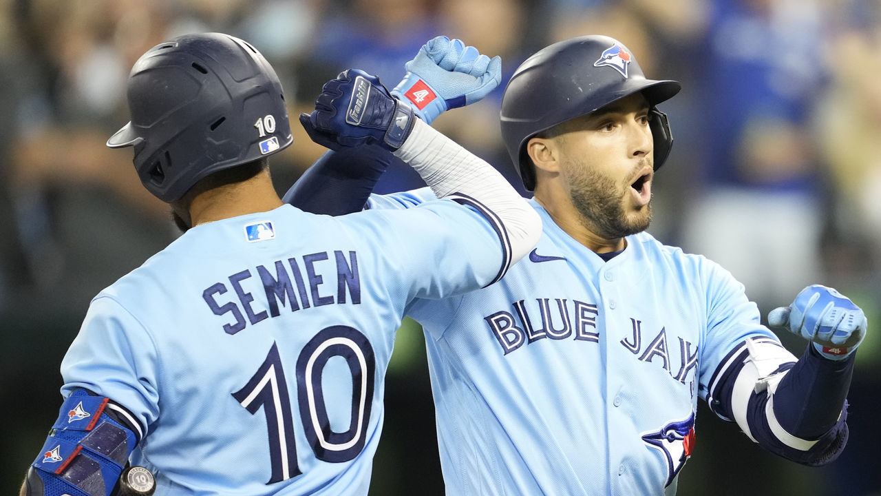 TORONTO, ONTARIO - OCTOBER 3: George Springer #4 of the Toronto Blue Jays celebrates his home run with teammate Marcus Semien #10 in the first inning during their MLB game against the Baltimore Orioles at the Rogers Centre on October 3, 2021 in Toronto, Ontario, Canada.