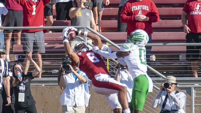 PALO ALTO, CA - OCTOBER 02: Stanford Cardinal wide receiver Elijah Higgins (6) pulls in the tie scoring touchdown in front of Oregon Ducks cornerback DJ James (0) during the game between the Oregon Ducks and Stanford Cardinal on Saturday, October 2, 2021 at Stanford Stadium in Palo Alto, California.