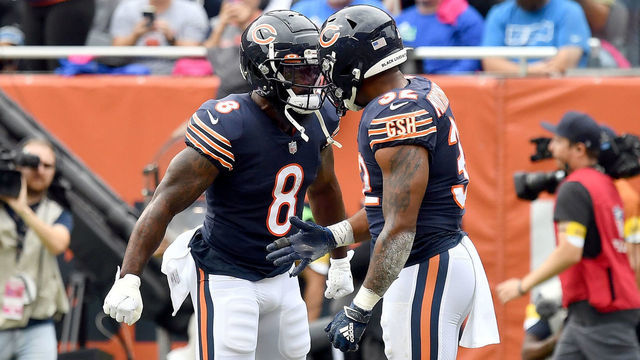 CHICAGO, ILLINOIS - OCTOBER 03: Damien Williams #8 and David Montgomery #32 of the Chicago Bears celebrate against the Detroit Lions in the first half at Soldier Field on October 03, 2021 in Chicago, Illinois.