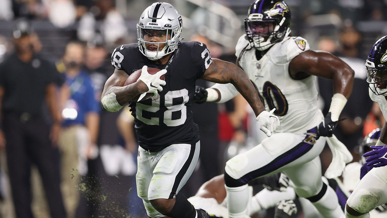 LAS VEGAS, NEVADA - SEPTEMBER 13: Running back Josh Jacobs #28 of the Las Vegas Raiders rushes the football against the Baltimore Ravens during the NFL game at Allegiant Stadium on September 13, 2021 in Las Vegas, Nevada. The Raiders defeated the Ravens 33-27 in overtime.