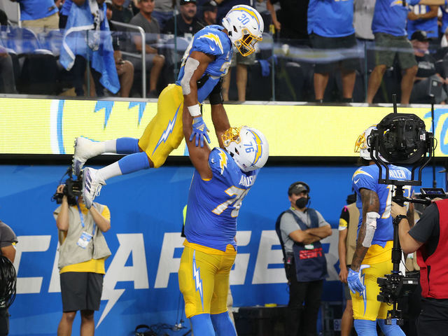 INGLEWOOD, CALIFORNIA - OCTOBER 04: Austin Ekeler #30 of the Los Angeles Chargers celebrates his touchdown with teammate offensive guard Oday Aboushi #76 against the Las Vegas Raiders during the second quarter at SoFi Stadium on October 4, 2021 in Inglewood, California.