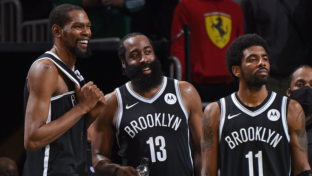BOSTON, MA - MAY 30: Kevin Durant #7, James Harden #13 and Kyrie Irving #11 of the Brooklyn Nets smile during the game against the Boston Celtics during Round 1, Game 4 of the 2021 NBA Playoffs on May 30, 2021 at the TD Garden in Boston, Massachusetts. Mandatory Copyright Notice: Copyright 2021 NBAE