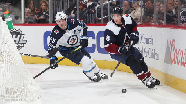 DENVER, COLORADO - DECEMBER 31: Cale Makar #8 of the Colorado Avalanche skates against Mark Scheifele #55 of the Winnipeg Jets at Pepsi Center on December 31, 2019 in Denver, Colorado.