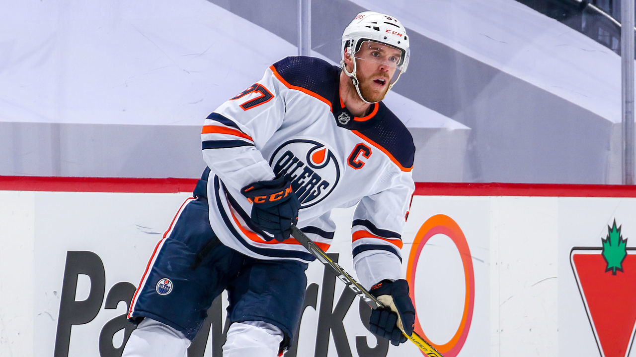 WINNIPEG, MB - MAY 24: Connor McDavid #97 of the Edmonton Oilers keeps an eye on the play during second period action against the Winnipeg Jets in Game Four of the First Round of the 2021 Stanley Cup Playoffs at Bell MTS Place on May 24, 2021 in Winnipeg, Manitoba.