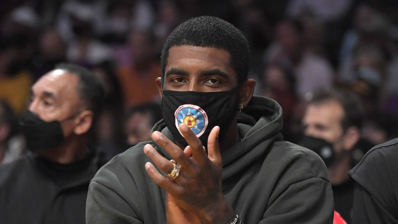 LOS ANGELES, CA - OCTOBER 03: Kyrie Irving #11 of the Brooklyn Nets cheers from the bench during a pre season game against the Los Angeles Lakers at Staples Center on October 3, 2021 in Los Angeles, California. NOTE TO USER: User expressly acknowledges and agrees that, by downloading and/or using this Photograph, user is consenting to the terms and conditions of the Getty Images License Agreement.