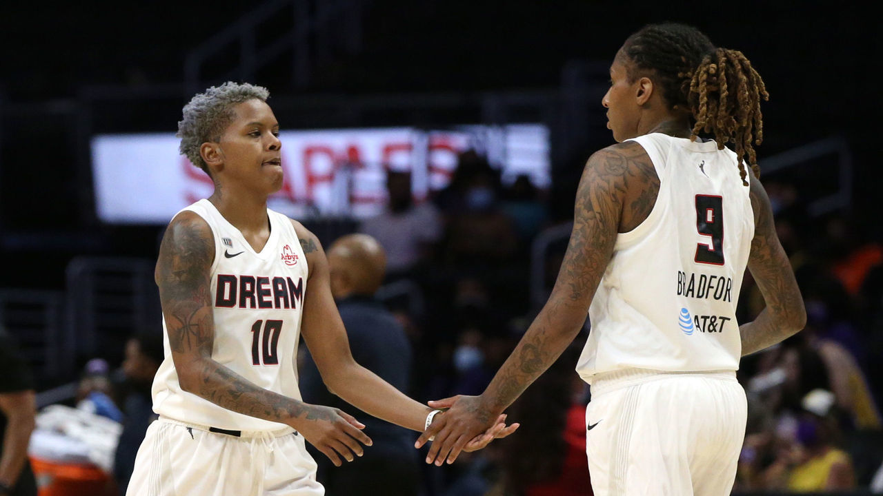LOS ANGELES, CALIFORNIA - AUGUST 17: Odyssey Sims #0, Candice Dupree #24, Courtney Williams #10, and Crystal Bradford #9 of the Atlanta Dream high-five on the court during a game against the Los Angeles Sparks at Staples Center on August 17, 2021 in Los Angeles, California.