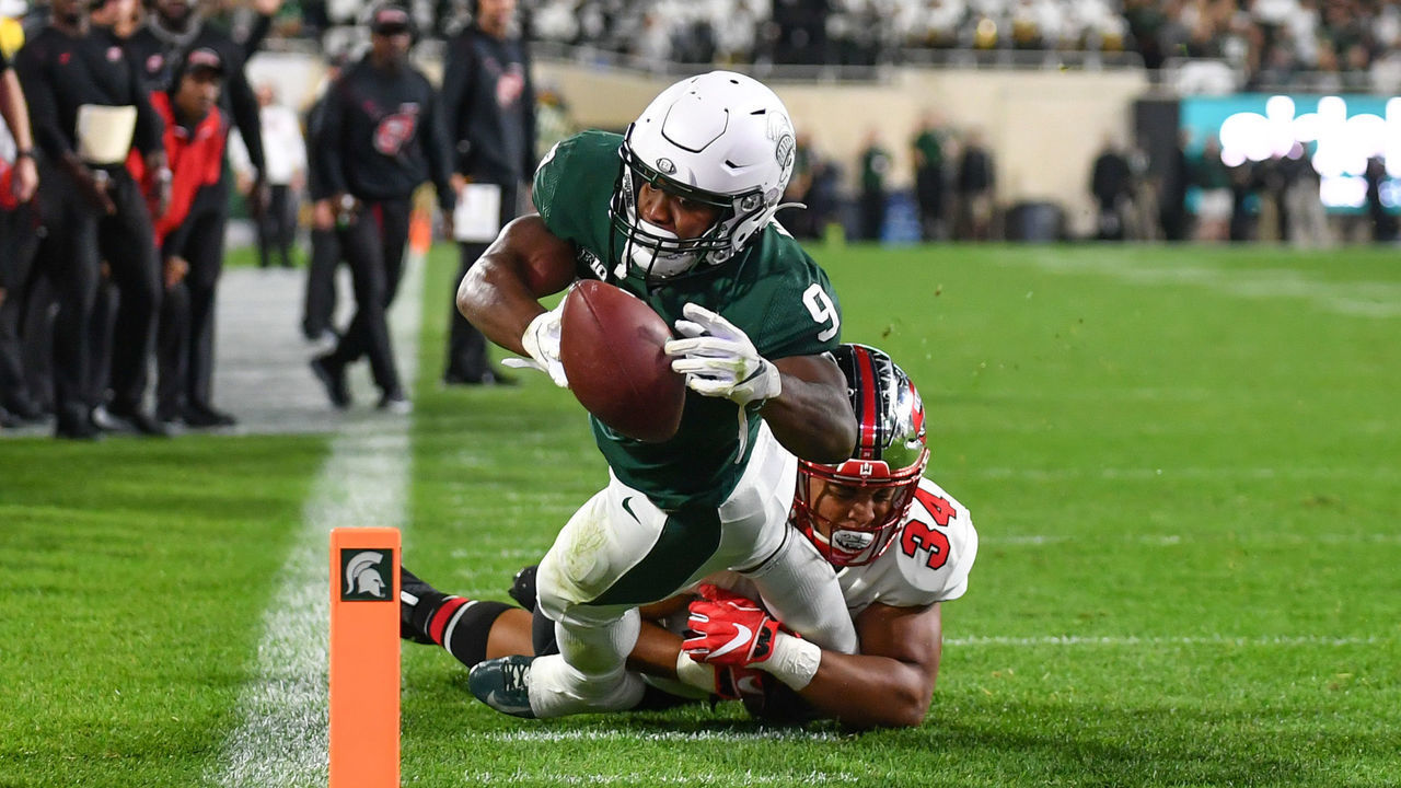 EAST LANSING, MI - OCTOBER 02: Michigan State Spartans running back Kenneth Walker (9) leaps toward the pylon during a college football game between the Michigan State Spartans and the Western Kentucky Hilltoppers on October 2, 2021 at Spartan Stadium in East Lansing, MI.