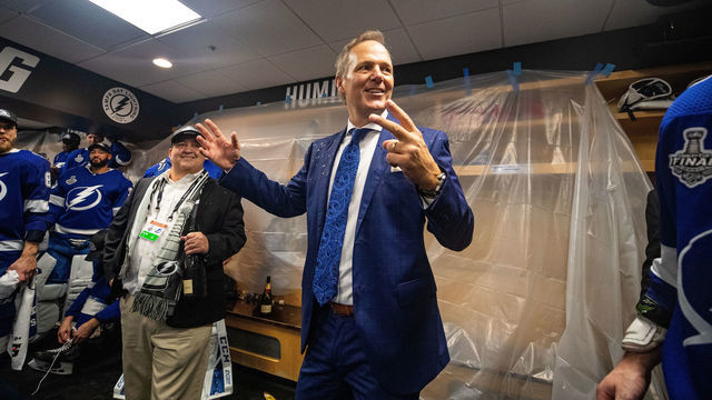 TAMPA, FL - JULY 7: Head Coach Jon Cooper of the Tampa Bay Lightning celebrates in the locker room with the Stanley Cup after the Tampa Bay Lightning defeated the Montreal Canadiens in Game Five to win the best of seven game series 4-1 during the Stanley Cup Final of the 2021 Stanley Cup Playoffs at Amalie Arena on July 7, 2021 in Tampa, Florida.