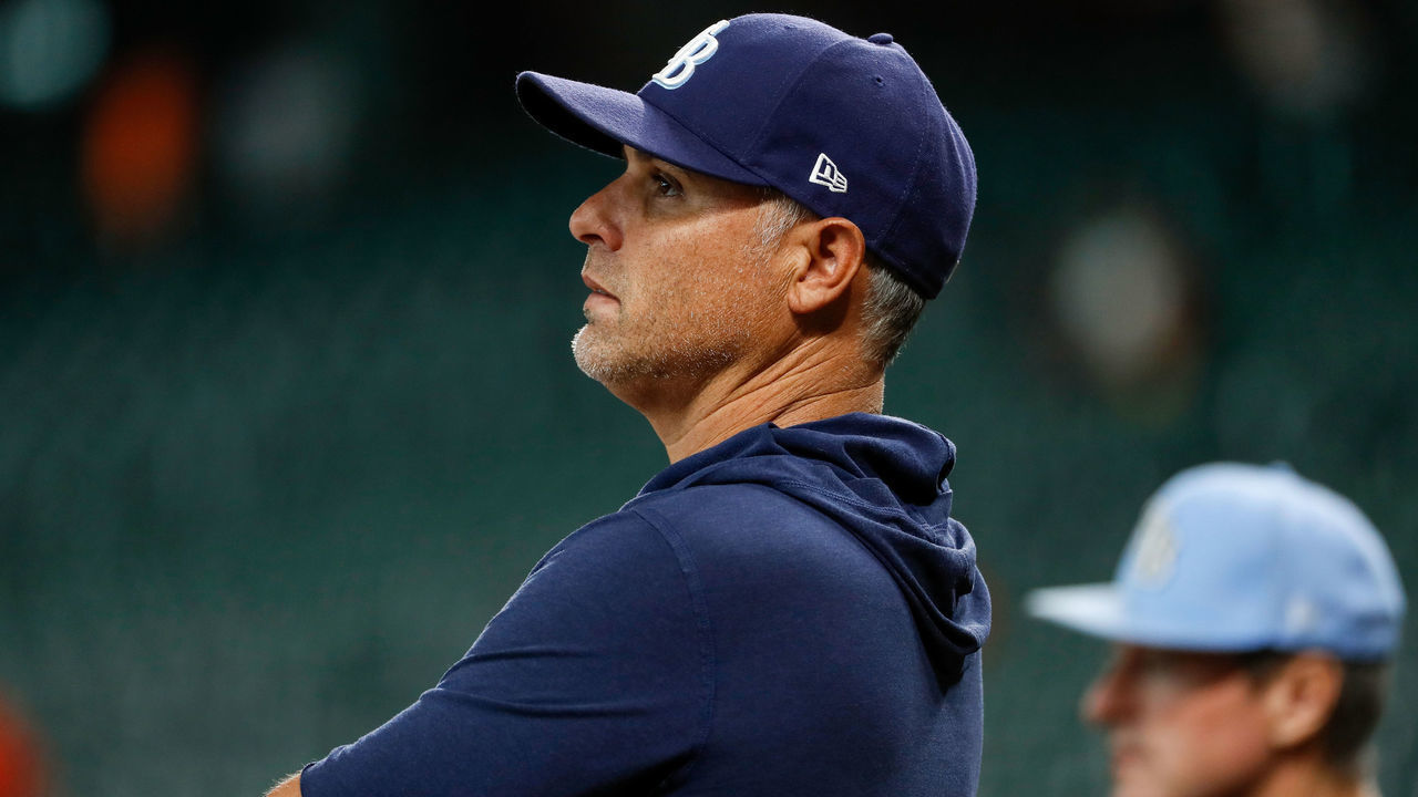HOUSTON, TEXAS - SEPTEMBER 30: Manager Kevin Cash #16 of the Tampa Bay Rays watches batting practice before the game against the Houston Astros at Minute Maid Park on September 30, 2021 in Houston, Texas.