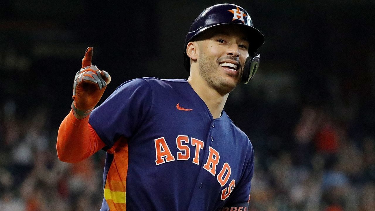 HOUSTON, TEXAS - OCTOBER 03: Carlos Correa #1 of the Houston Astros hits a home run in the eighth inning against the Oakland Athletics at Minute Maid Park on October 03, 2021 in Houston, Texas.
