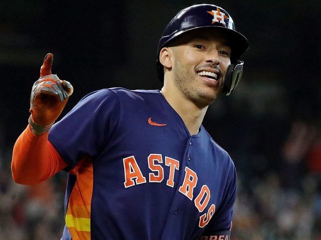 HOUSTON, TEXAS - OCTOBER 03: Carlos Correa #1 of the Houston Astros hits a home run in the eighth inning against the Oakland Athletics at Minute Maid Park on October 03, 2021 in Houston, Texas.