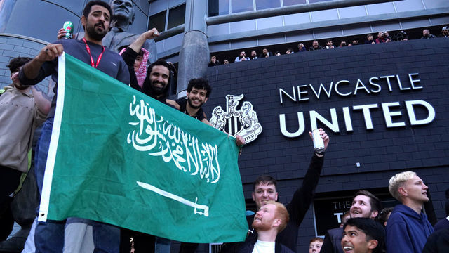 Newcastle United fans celebrate at St James' Park following the announcement that The Saudi-led takeover of Newcastle has been approved. Picture date: Thursday October 7, 2021.