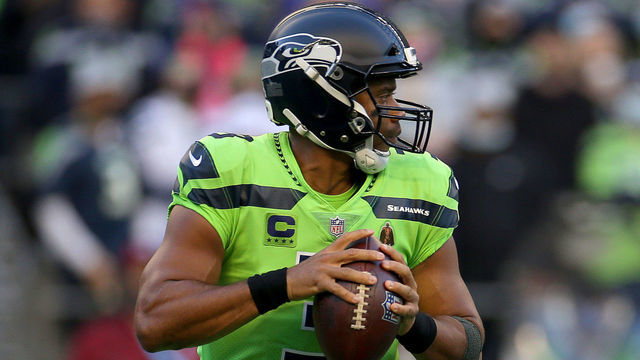 SEATTLE, WASHINGTON - OCTOBER 07: Quarterback Russell Wilson #3 of the Seattle Seahawks looks to pass against the Los Angeles Rams in the first half at Lumen Field on October 07, 2021 in Seattle, Washington.