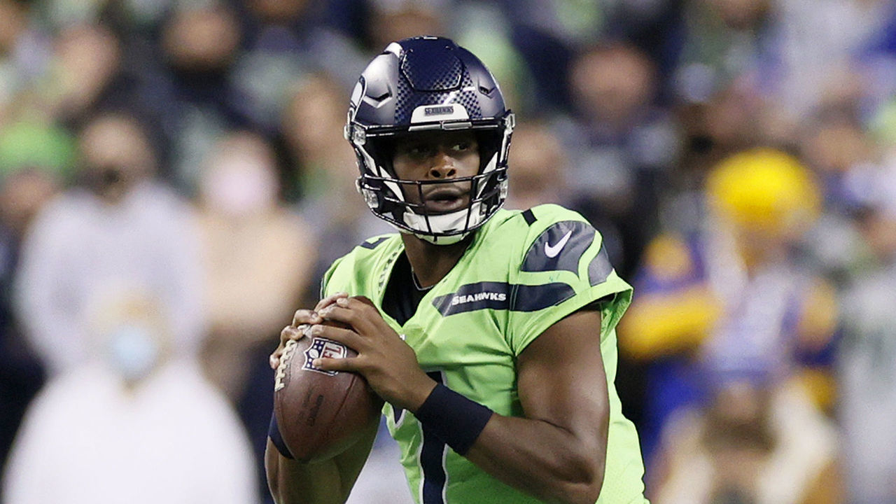 SEATTLE, WASHINGTON - OCTOBER 07: Geno Smith #7 of the Seattle Seahawks looks to pass against the Los Angeles Rams during the fourth quarter at Lumen Field on October 07, 2021 in Seattle, Washington.