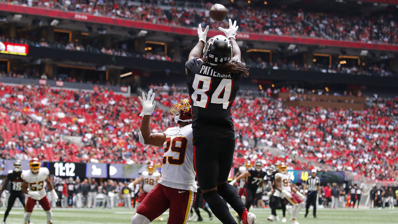 ATLANTA, GEORGIA - OCTOBER 03: Cordarrelle Patterson #84 of the Atlanta Falcons scores a touchdown reception against Kendall Fuller #29 of the Washington Football Team in the third quarter at Mercedes-Benz Stadium on October 03, 2021 in Atlanta, Georgia.