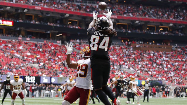 ATLANTA, GEORGIA - OCTOBER 03: Cordarrelle Patterson #84 of the Atlanta Falcons scores a touchdown reception against Kendall Fuller #29 of the Washington Football Team in the third quarter at Mercedes-Benz Stadium on October 03, 2021 in Atlanta, Georgia.