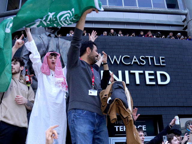 Newcastle United fans celebrate at St James' Park following the announcement that The Saudi-led takeover of Newcastle has been approved. Picture date: Thursday October 7, 2021.