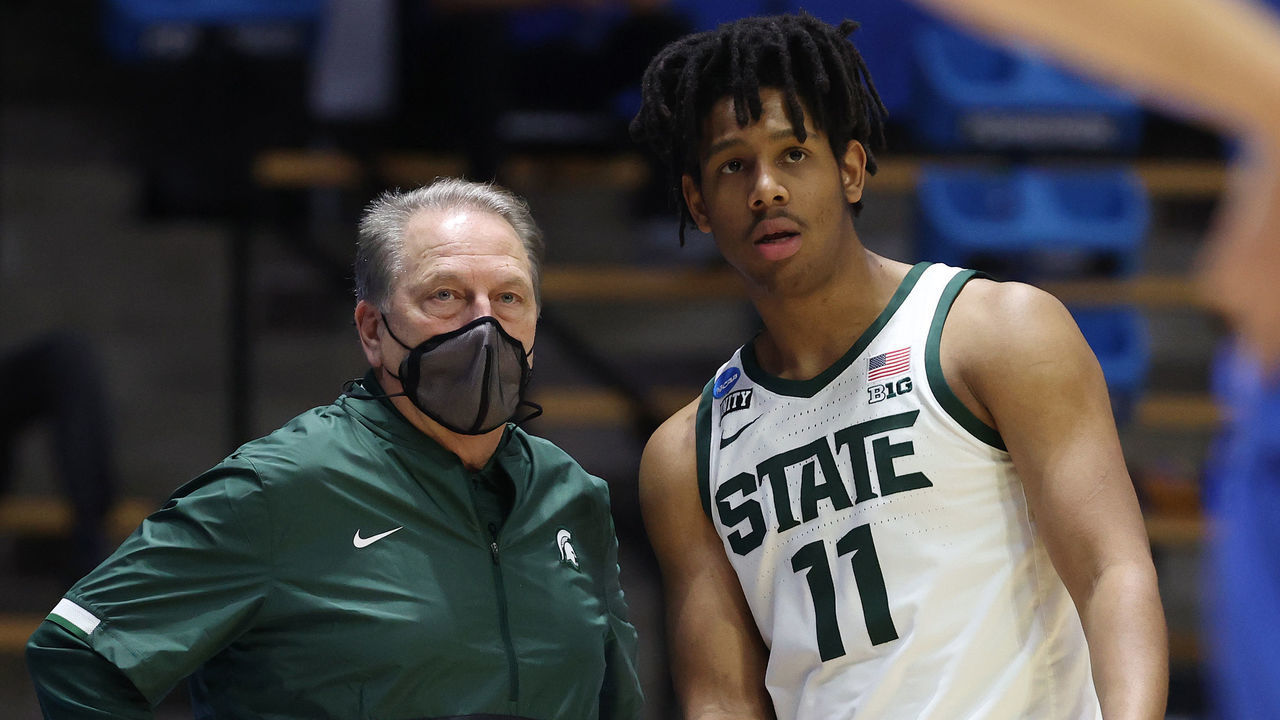 WEST LAFAYETTE, INDIANA - MARCH 18: Head coach Tom Izzo of the Michigan State Spartans talks with A.J. Hoggard #11 against the UCLA Bruins during the second half in the First Four game prior to the NCAA Men's Basketball Tournament at Mackey Arena on March 18, 2021 in West Lafayette, Indiana.
