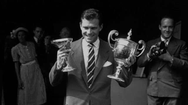 7th July 1950: Budge Patty with his men's singles trophy at the Wimbledon Lawn Tennis Championships.