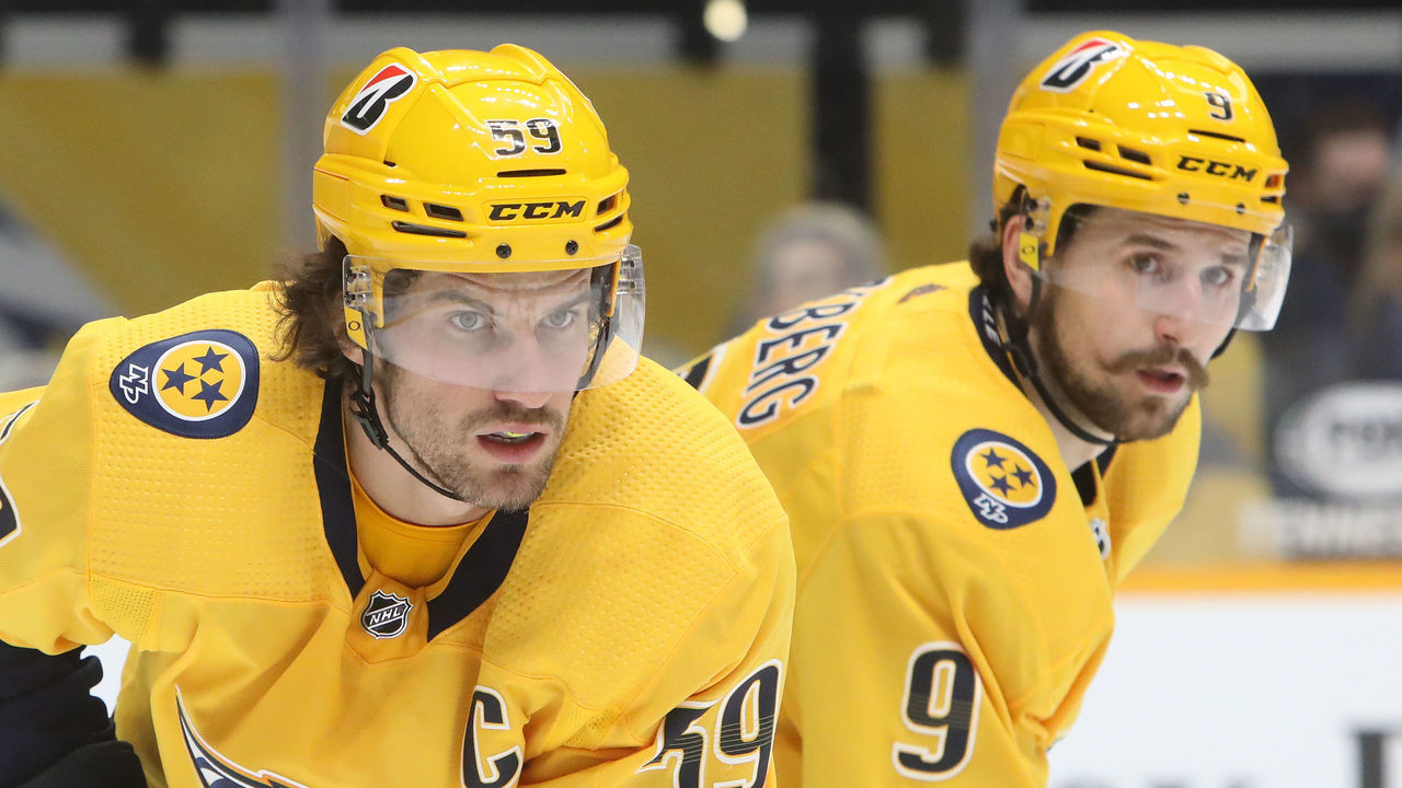 NASHVILLE, TN - JANUARY 18: Nashville Predators defenseman Roman Josi (59), of Switzerland, is shown during the NHL game between the Nashville Predators and Carolina Hurricanes, held on January 18, 2021, at Bridgestone Arena in Nashville, Tennessee. Also shown is left wing Filip Forsberg (9).