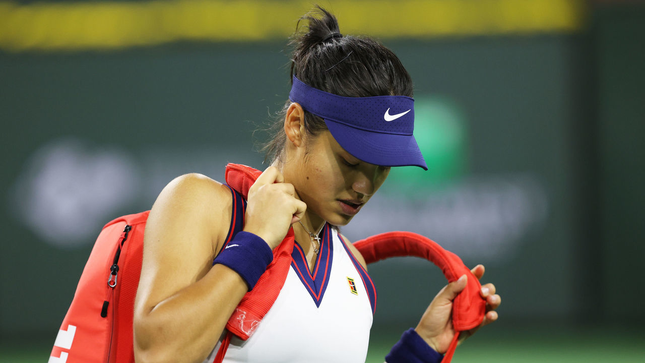 INDIAN WELLS, CALIFORNIA - OCTOBER 08: Emma Raducanu of Great Britain grabs her racket bag ready to walk off court after her straight sets defeat against Aliaksandra Sasnovich of Belarus in their second round match on Day 5 of the BNP Paribas Open at the Indian Wells Tennis Garden on March 08, 2021 in Indian Wells, California.